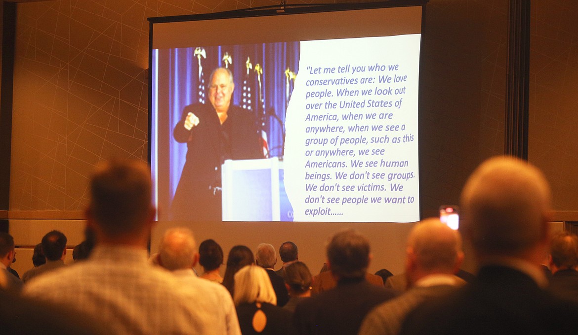 The crowd at the Lincoln Day Dinner Saturday at The Coeur d'Alene Resort stands during a video tribute to the late Rush Limbaugh.