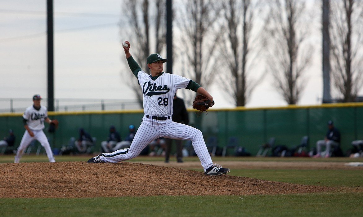 Big Bend's Vance Alvarado makes the pitch after coming in as relief in the second game of the day for the Vikes against Spokane Community College on Saturday.