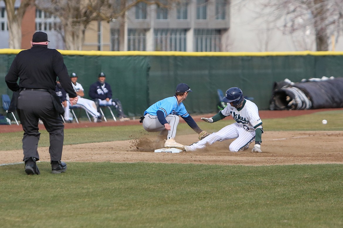 Big Bend's Tristen Garland slides into third base in the second game of the day against Spokane CC on Saturday afternoon at Big Bend Community College.