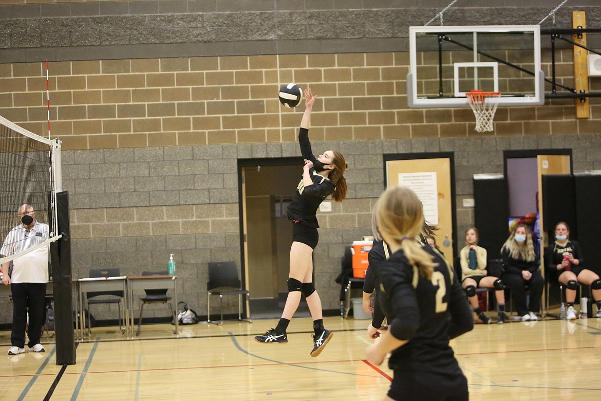Royal's Kate Larsen goes up for the kill in the match against Wahluke on Saturday at Royal Intermediate School.