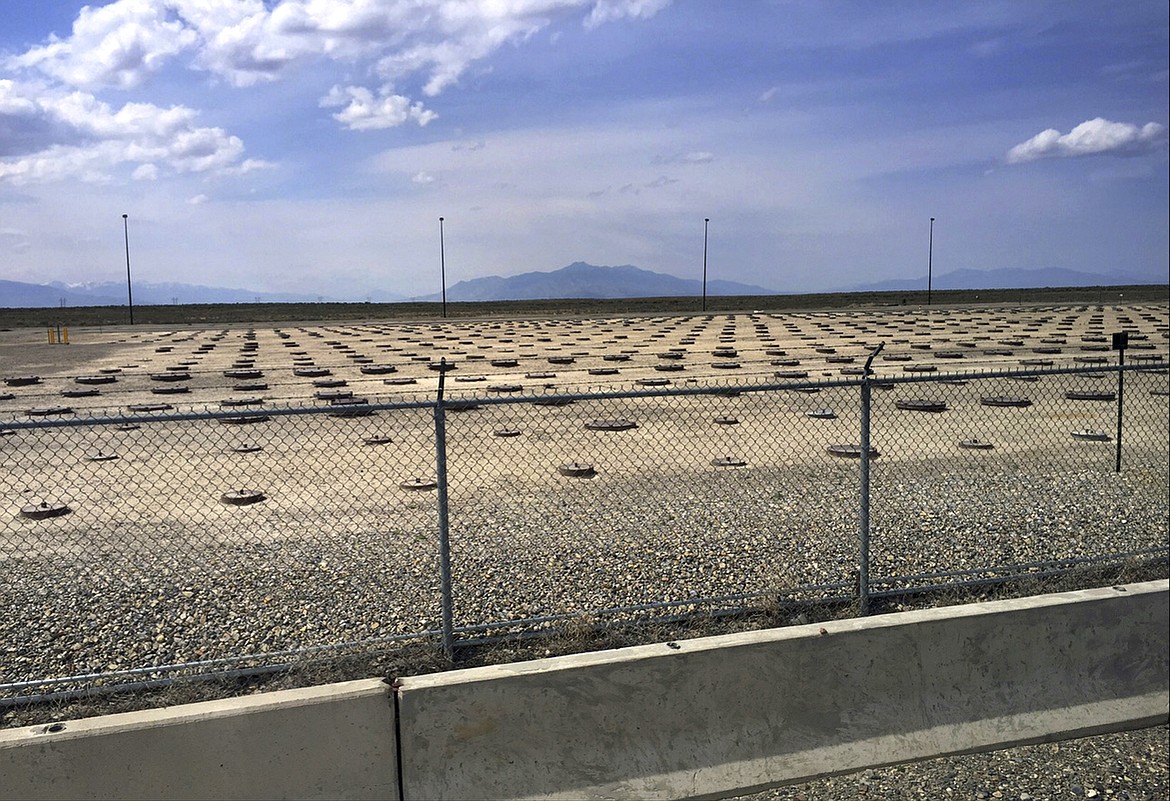 In this May 11, 2015, file photo, nuclear waste is stored in underground containers at the Idaho National Laboratory near Idaho Falls, Idaho. U.S. and state officials say ongoing Superfund cleanup work of radioactive and other contamination at the Idaho National Laboratory in eastern Idaho has been successful at protecting humans and the environment.