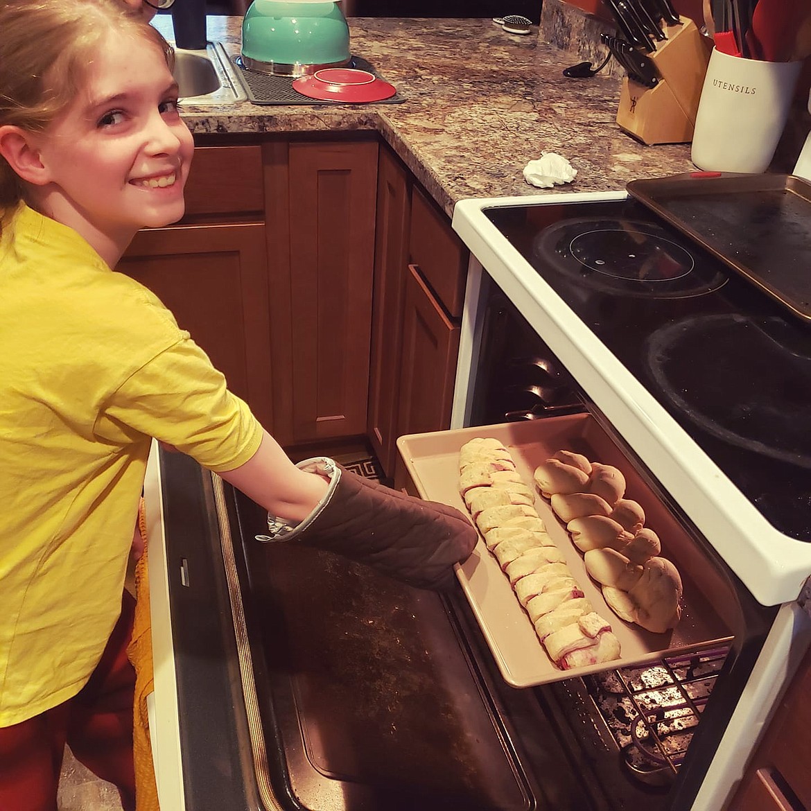 Freya Bearly, a fifth grade student in Mac Hollan's class, baking at home.