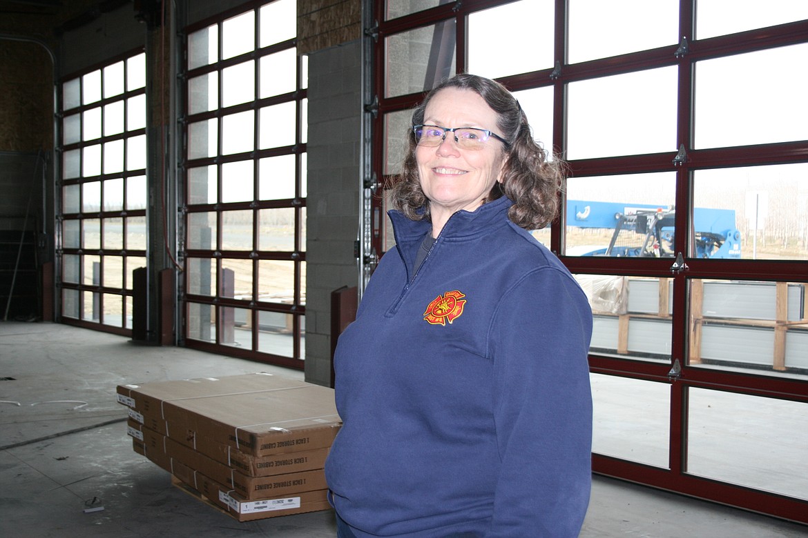 Barbara Davis, Grant County Fire District 8 business manager, in the equipment bay of the district's new fire hall, scheduled to open in early May.