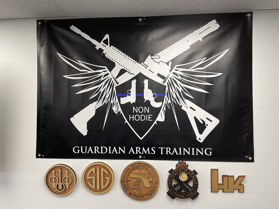 Guardian Arms logo.