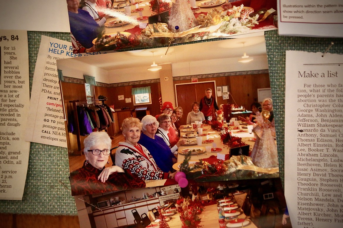 Photos of previous Ferndale Sewing Circle gatherings decorate a bulletin board inside the clubhouse at Ferndale Community Center.
Mackenzie Reiss/Bigfork Eagle