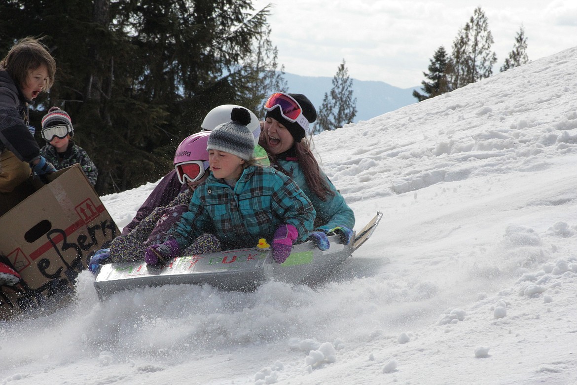 Annemarie, Morrison, Mikaia and Halo sled at Schweitzer mountain Tuesday morning.