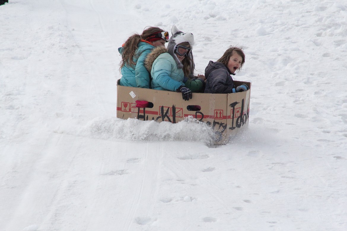 Morrison, Shawnee and Caylee slide down the hill Tuesday morning at Schweitzer.