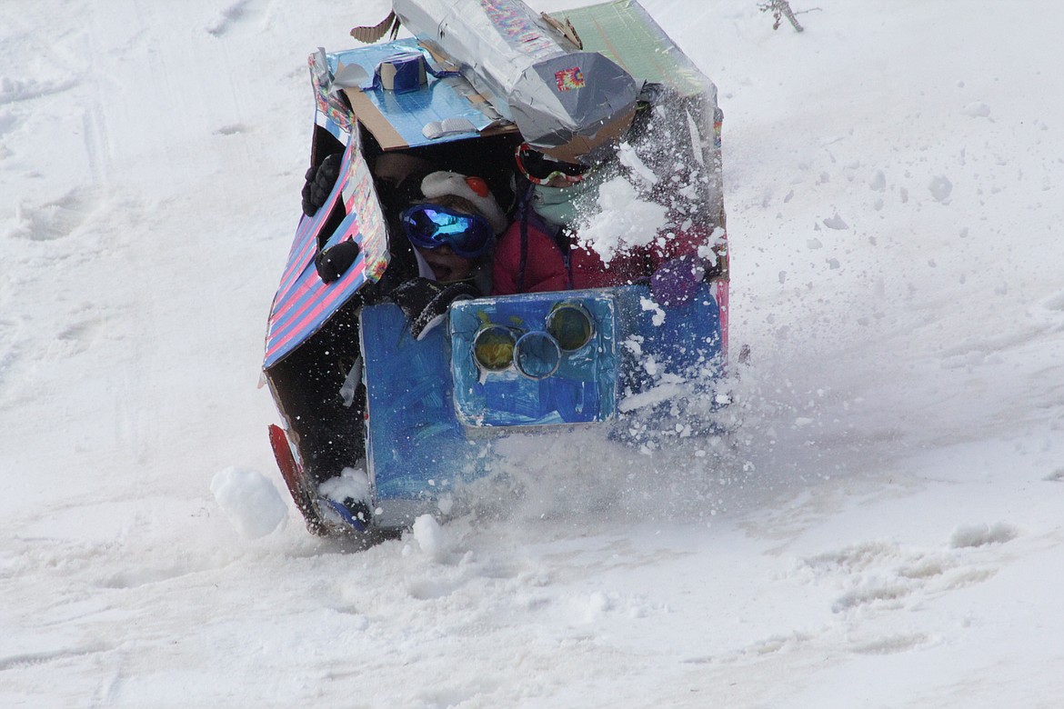 Toboggans are slowly demolished with each run as students at the Homeschool Academy slide down the hill at Schweitzer Tuesday morning.