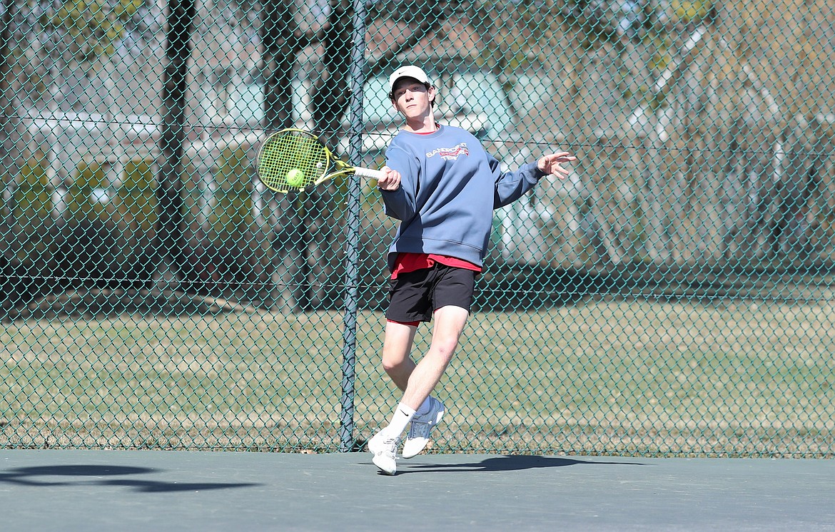 Josh Embree steps back to hit a forehand on Wednesday.