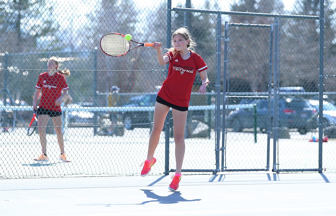 Maile Evans elevates to hit a forehand on Wednesday.