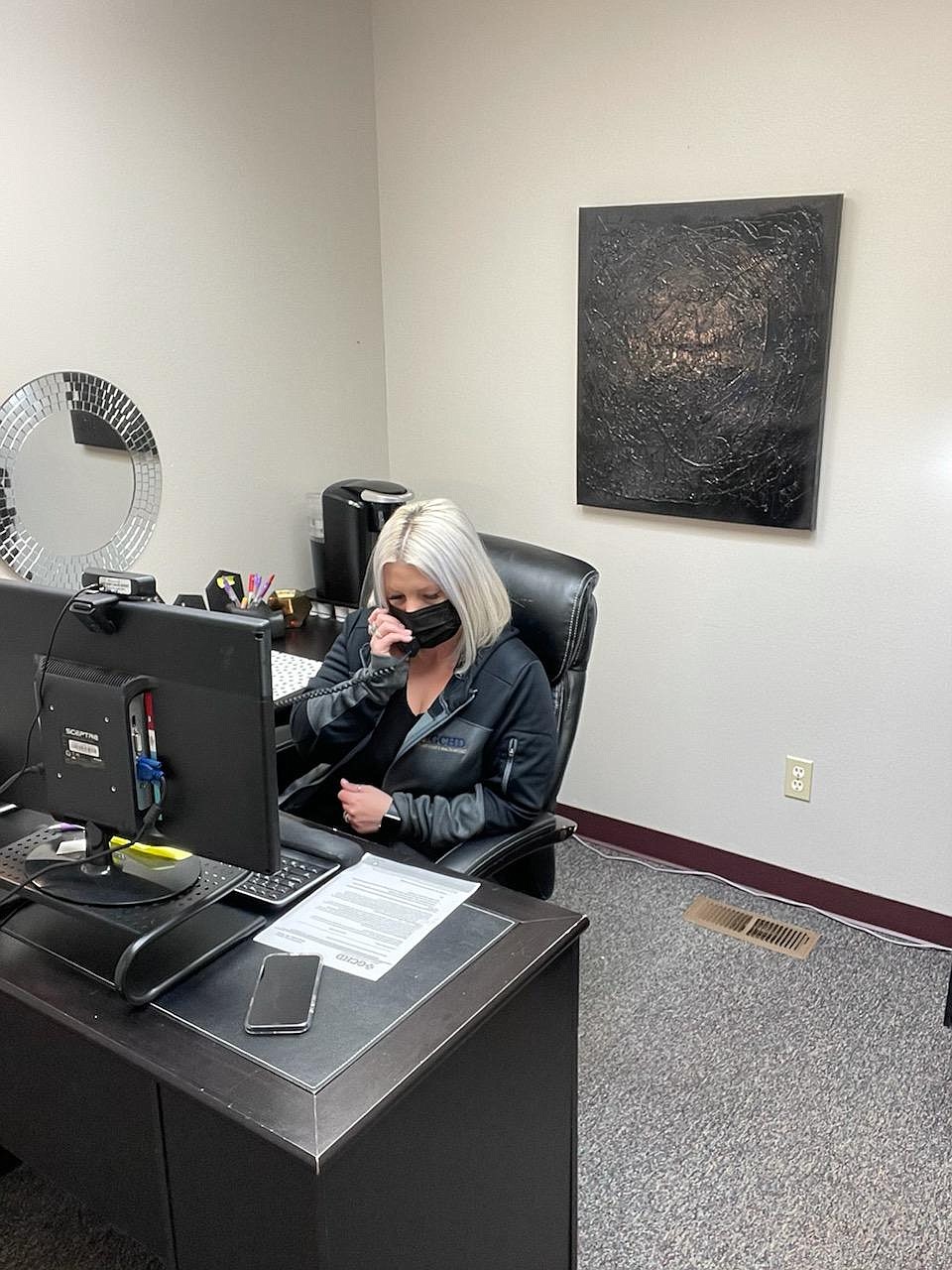 New Grant County Health District public information officer Misty Augilar at her desk.