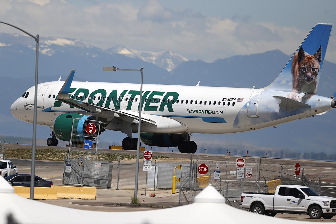 FILE - In this June 10, 2020 file photo, a Frontier Airlines jet heads down a runway for take off from Denver International Airport as travelers deal with the effects of the new coronavirus in Denver. Fans of Frontier Airlines can now buy a piece of the budget carrier. Frontier shares were expected to begin public trading Thursday, April 1, 2021, and company executives are hoping to get a tailwind from what seems to be a recovery in air travel. (AP Photo/David Zalubowski, File)