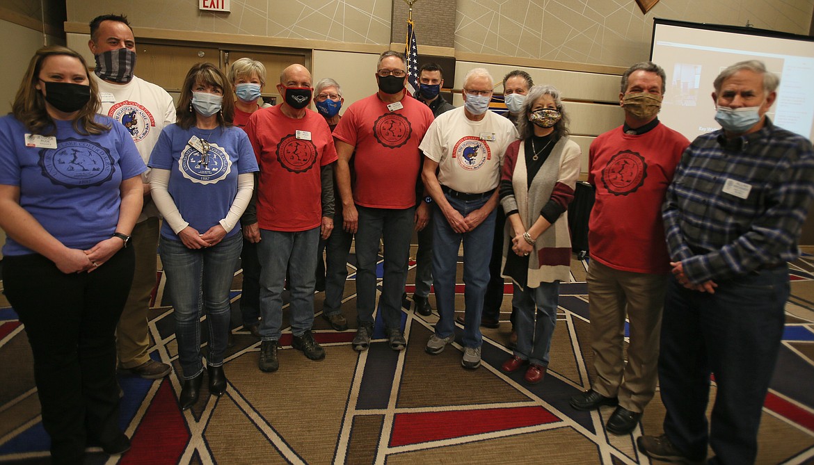 Sunrise Rotary's University of Lake Coeur d'Alene T-shirts bearing the Fighting Kokanee mascot are selling for $20 to support Safe Passage during April, which is Sexual Assault Awareness Month. Sunrise Rotary members are pictured here rocking their ULCDA shirts at a February meeting.