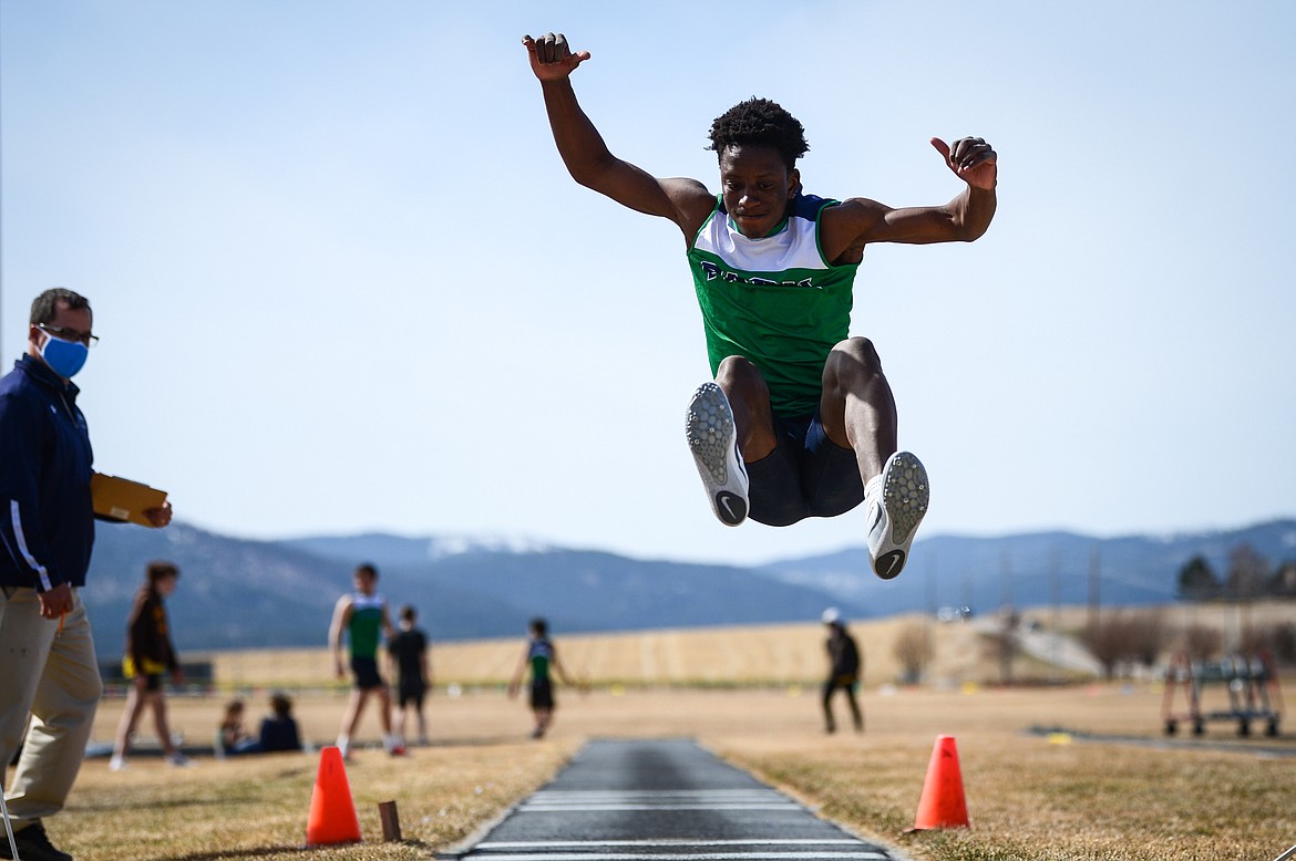 Glacier's Jeff Lillard jumps 18' 8 1/2 inches in the long jump against Helena Capital at Glacier High School on Friday. (Casey Kreider/Daily Inter Lake)