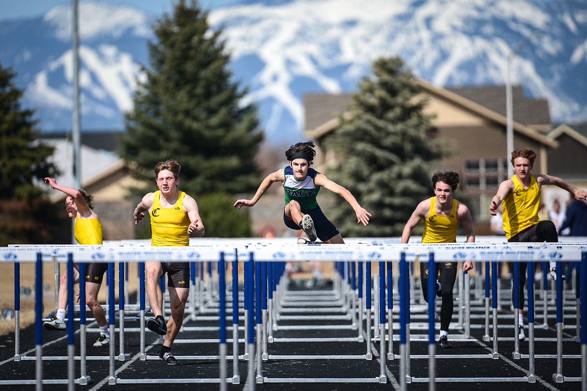 Glacier's Stephen Crowder competes in the boys' 100 meter hurdles against Helena Capital at Glacier High School on Friday. (Casey Kreider/Daily Inter Lake)