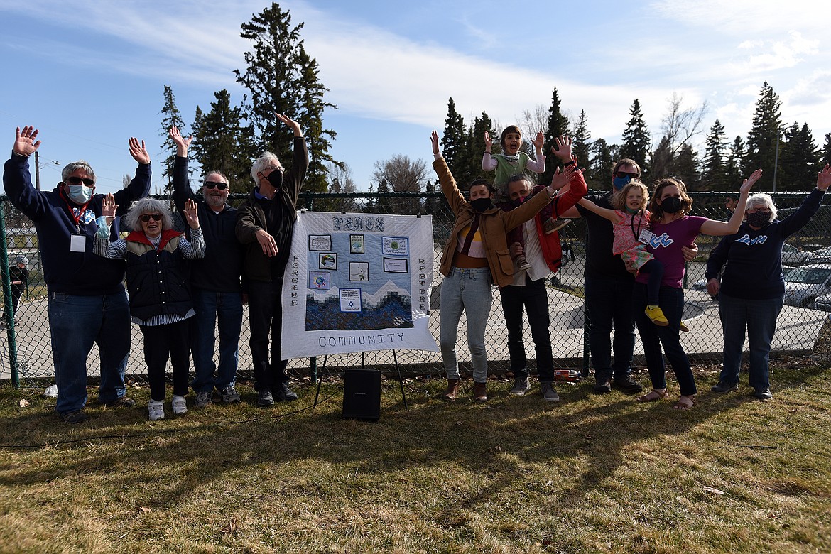 Reverend Miriam Mauritzen was named the Peacemaker of the Year by Love Lives Here in the Flathead Valley and the Mountain View Mennonite Church Thursday for her work with the Serious JuJu skateboard ministry. Pictured, from left, are Tom Esch, Mary Gibson, Reverend Kirk Kestler, Allan McGarvey, Elma Giavasis, Nina Giavasis, George Giavasis, Clayton Mauritzen, Elanor Mauritzen, Reverend Miriam Mauritzen and Deloris Lynch. (Jeremy Weber/Daily Inter Lake)