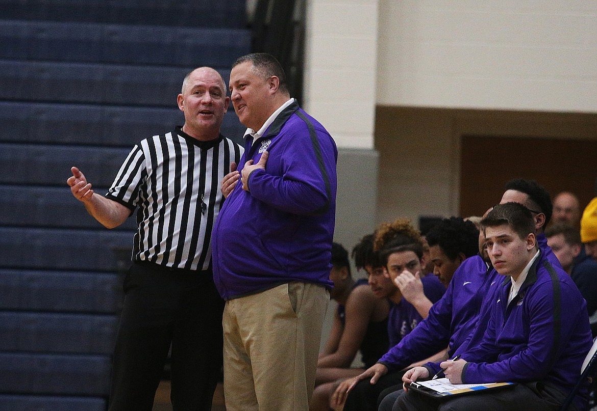 Then-Heritage coach, now Sandpoint High School boys basketball coach Brian Childs, discusses a call with referee Jeff Ward during a game in the Lake City Invitational against Coeur d’Alene on Jan. 2, 2020.