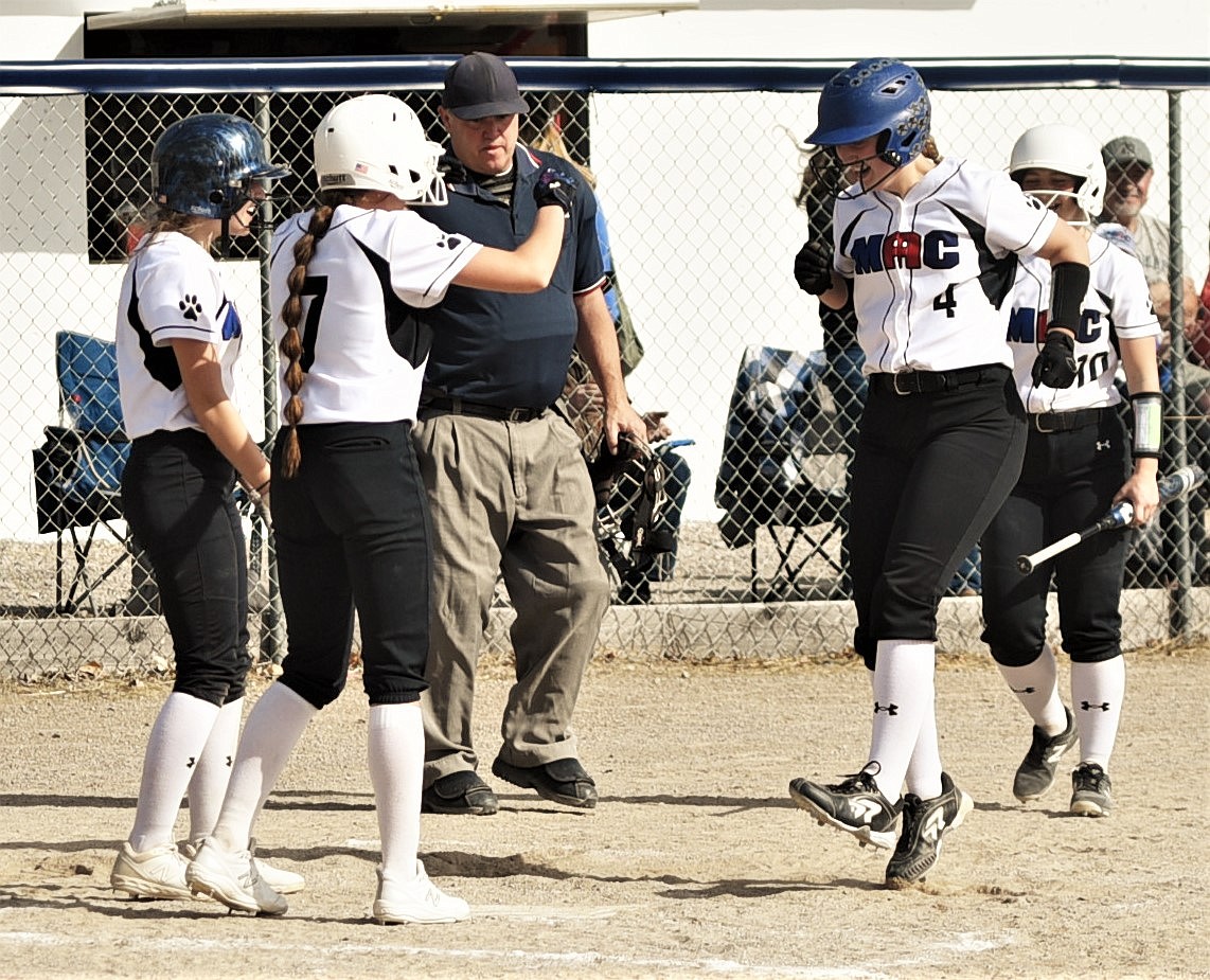 Izzy Evans (4) comes home after her sixth-inning grand slam against Eureka. (Scot Heisel/Lake County Leader)