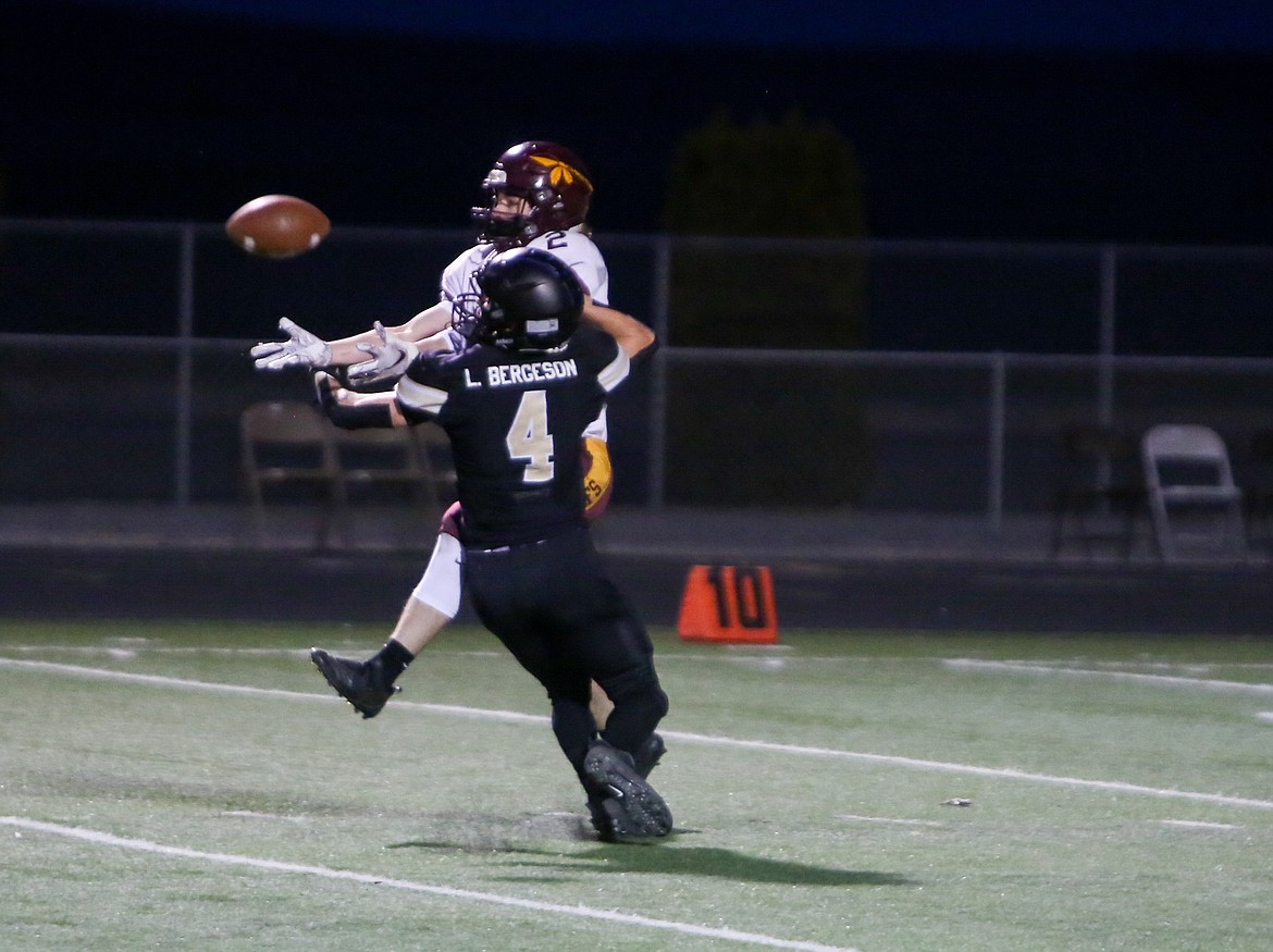 Moses Lake's Asher Lindgren pulls in a catch over Royal's Luke Bergeson in the first half on Friday night at Royal High School.