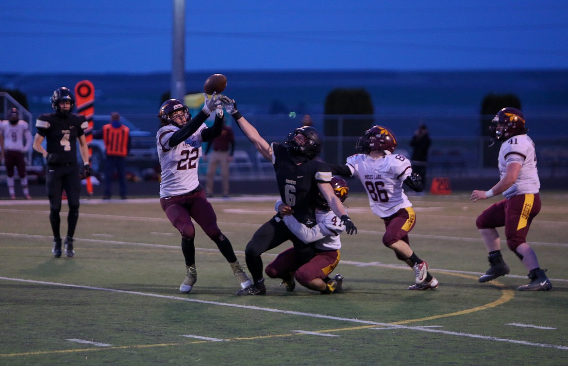 Moses Lake's Jackson Purcell takes advantage of a bobbled catch to pull in the first of two interceptions in the second quarter against Royal on Friday night.