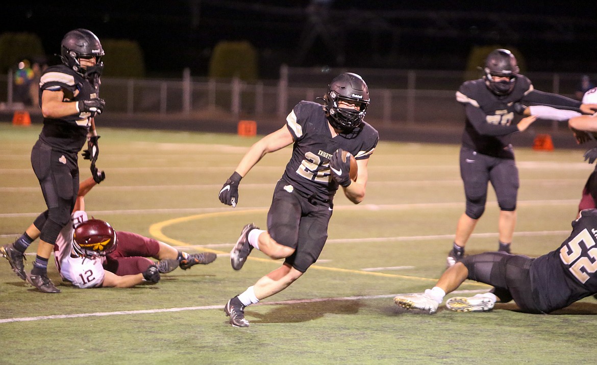 Royal's Avery Ellis powers upfield for the Knights as they capped off the undefeated season on Friday night against Moses Lake.