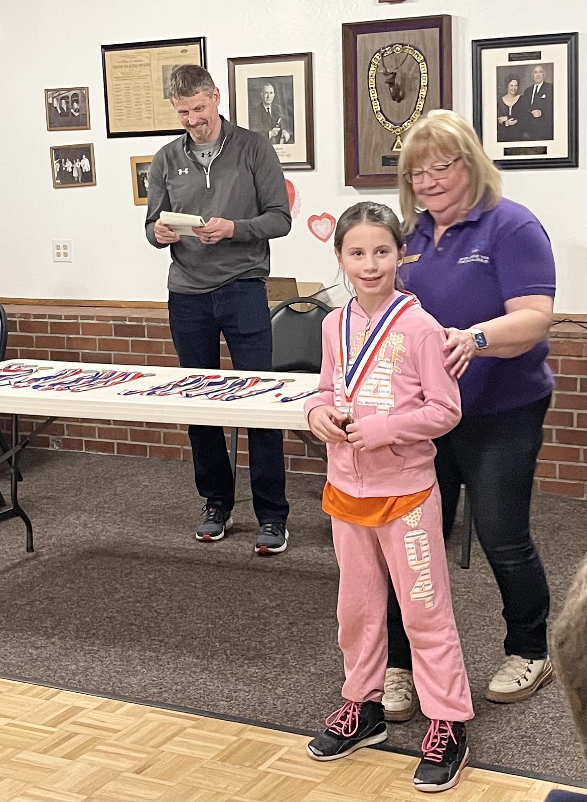 Courtesy photo
Quinn Paulson won the girls 8-9 age group at the Coeur d'Alene Elks Hoop Shoot Feb. 20 at The Courts at Real Life in Post Falls. Also pictured is Debbi Nadrchal, Elks Exalted Ruler.