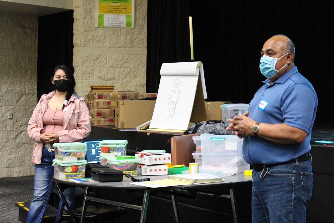 Facilitators Adriana Luna-Reyna and Juan Avalos lead the introduction of the Strengthening Families Program at Quincy Middle School on Friday.
