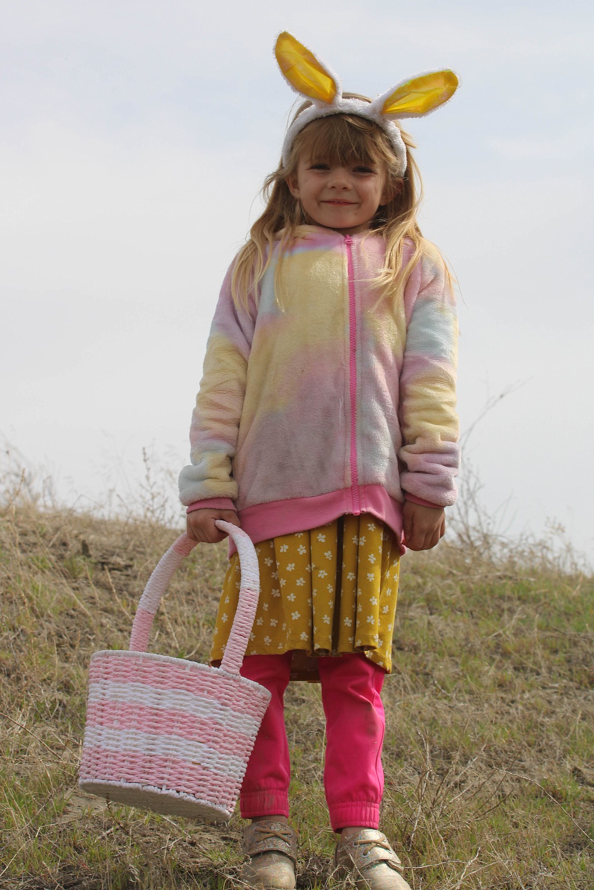 Moses Lake resident Danielle Tewson smiles at the Sand Scorpions Easter Egg Hunt at the sand dunes on Saturday.