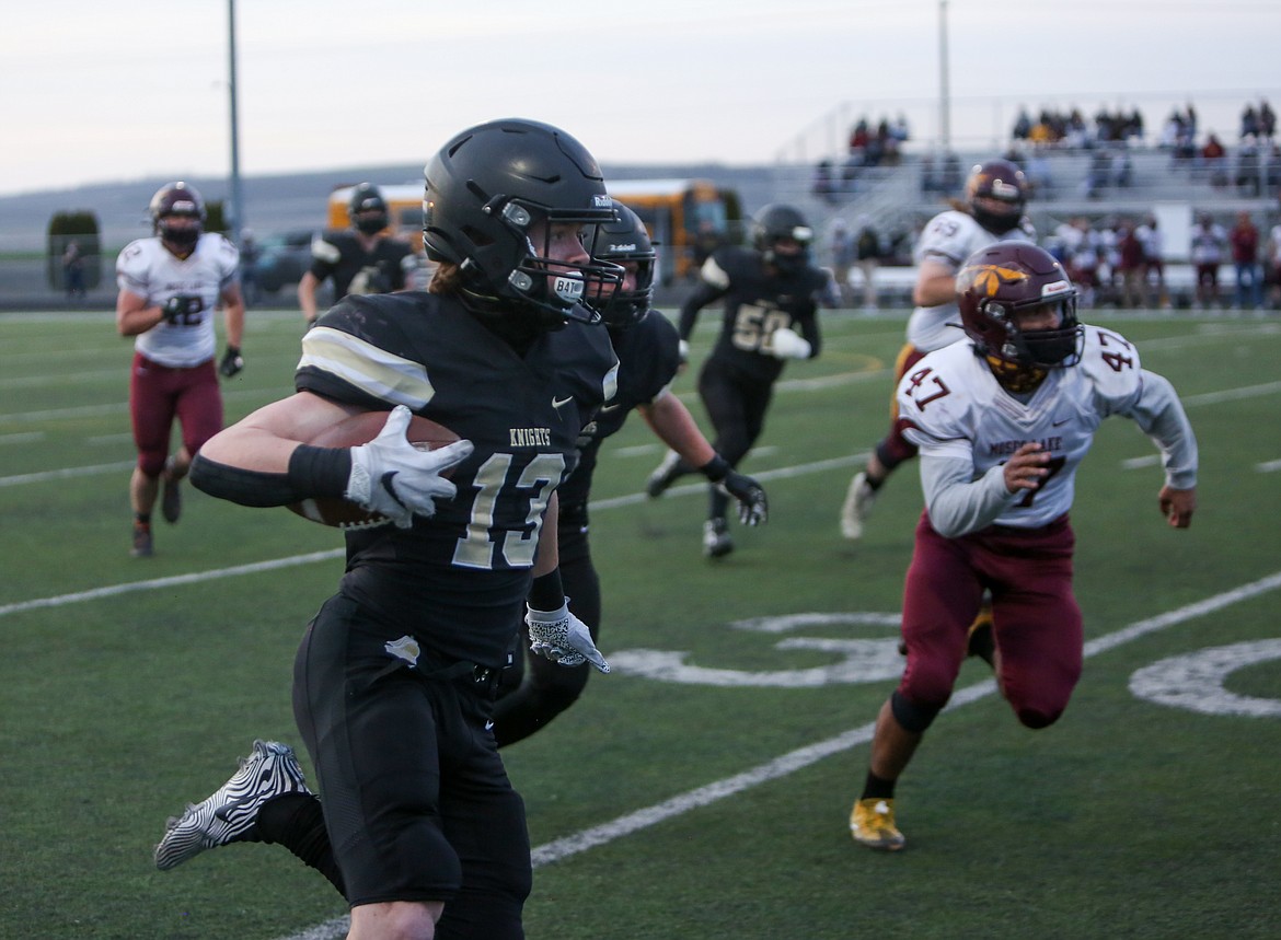Royal's Cooper Christensen makes his way down the sideline after making a catch in the first half on Friday night at Royal High School.