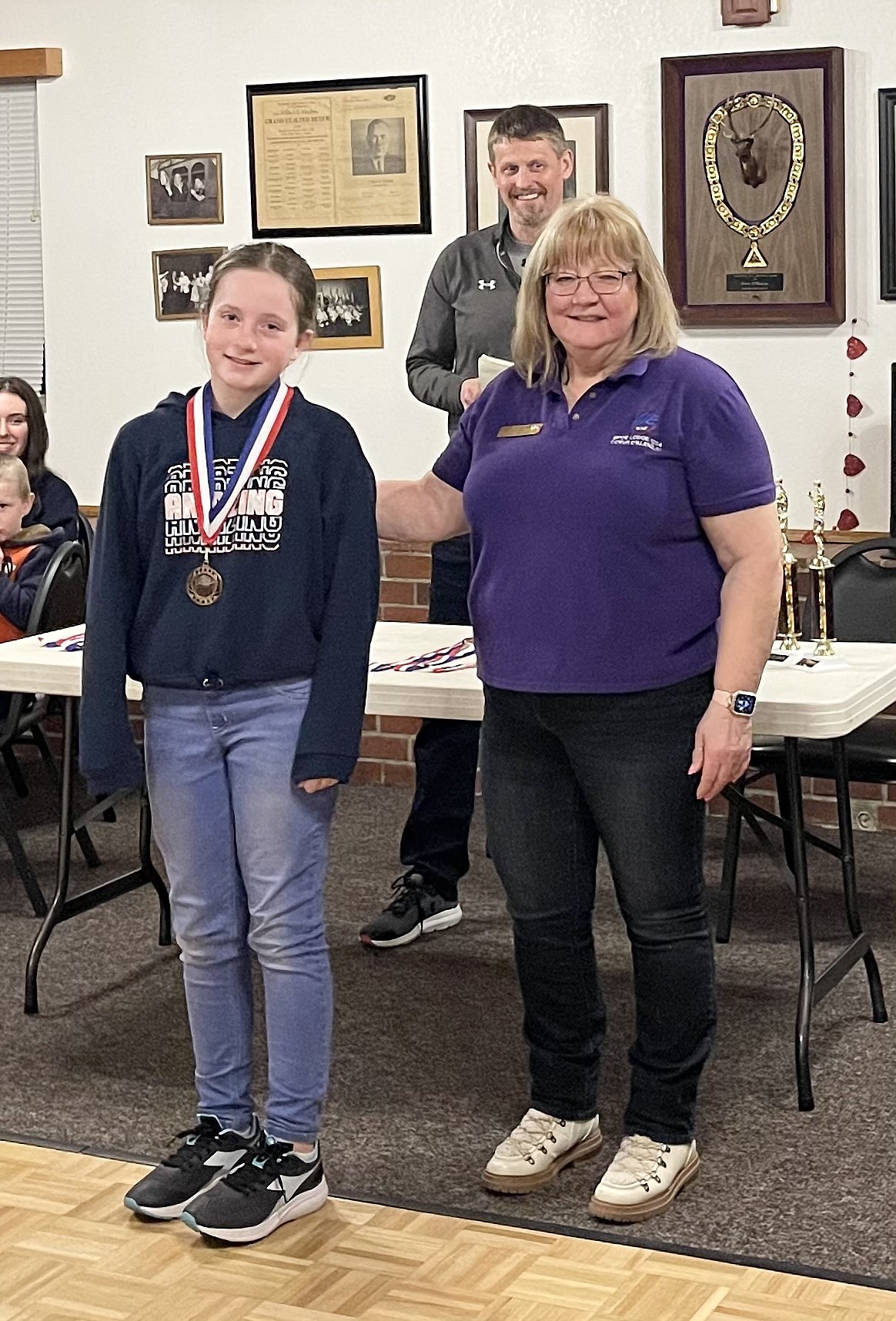 Courtesy photo
BrieLynn Jones won the girls 10-11 age division at the Coeur d'Alene Elks Hoop Shoot held Feb. 20 at The Courts at Real Life in Post Falls. Also pictured is Debbi Nadrchal, Elks Exalted Ruler, and Todd Stoddard, Hoop Shoot director.