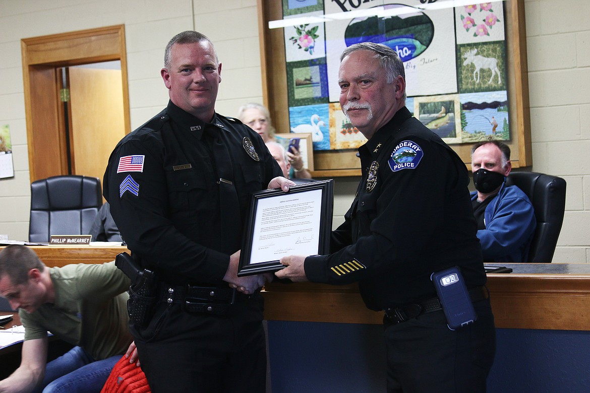 Chief Jimmy Cornelius awards Sergeant Jeremy Deal for his live-saving efforts in a car crash last summer.