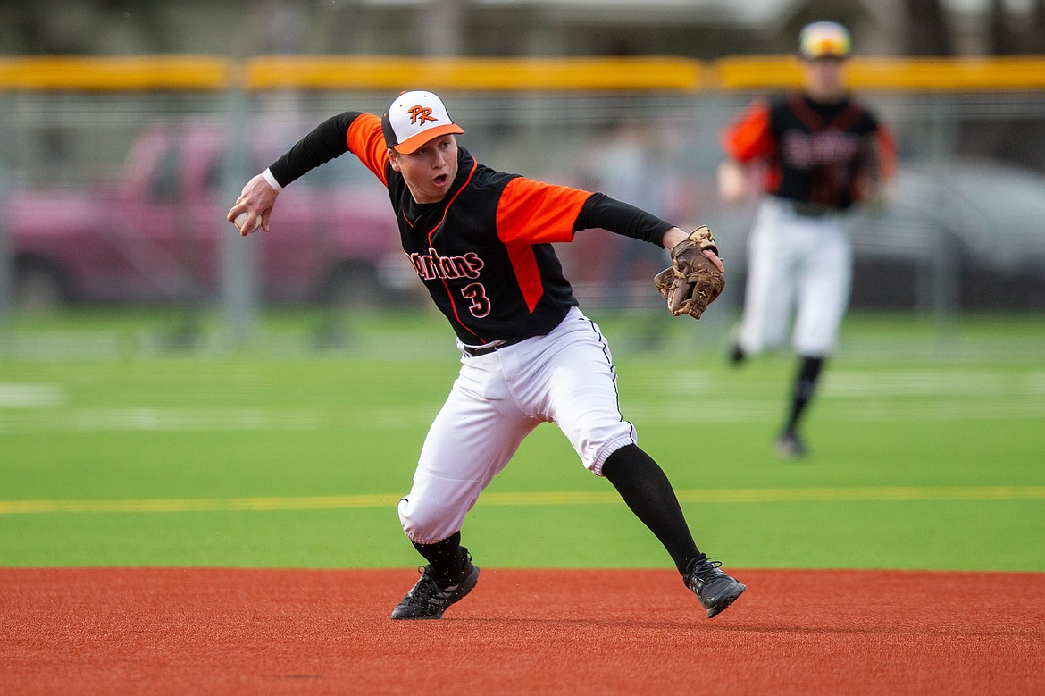 Senior Coby Rogers makes a throw to first to record an out during last Thursday's doubleheader against Sandpoint.