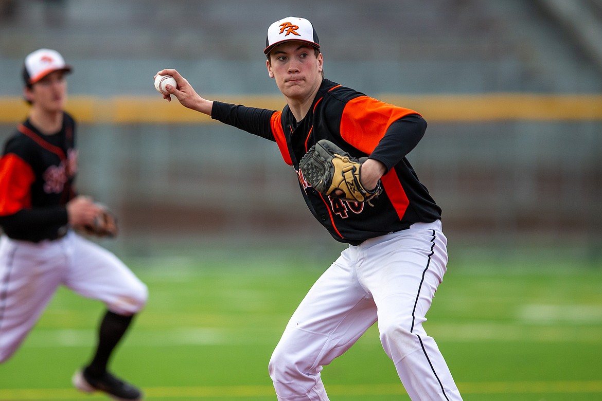 Landon Reynolds prepares to make a throw to first during last Thursday's doubleheader.