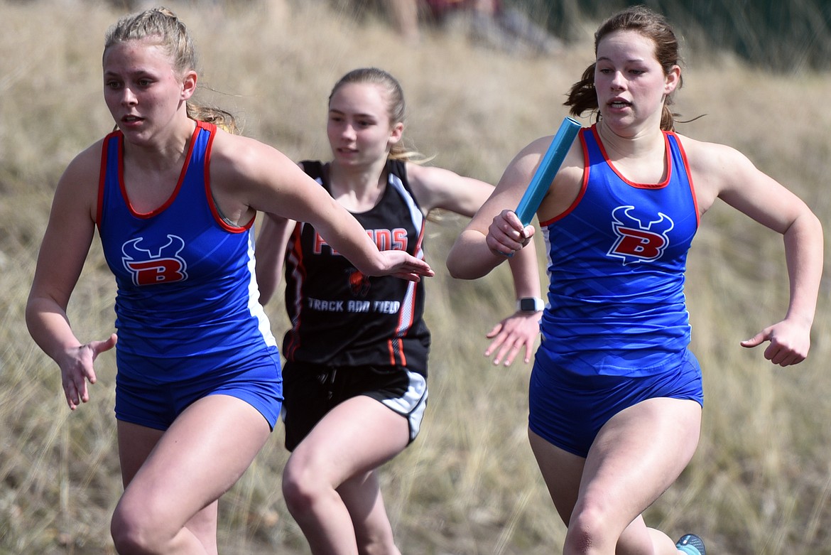 Relay runners race around the track at Bigfork High School.
Jeremy Weber/Bigfork Eagle