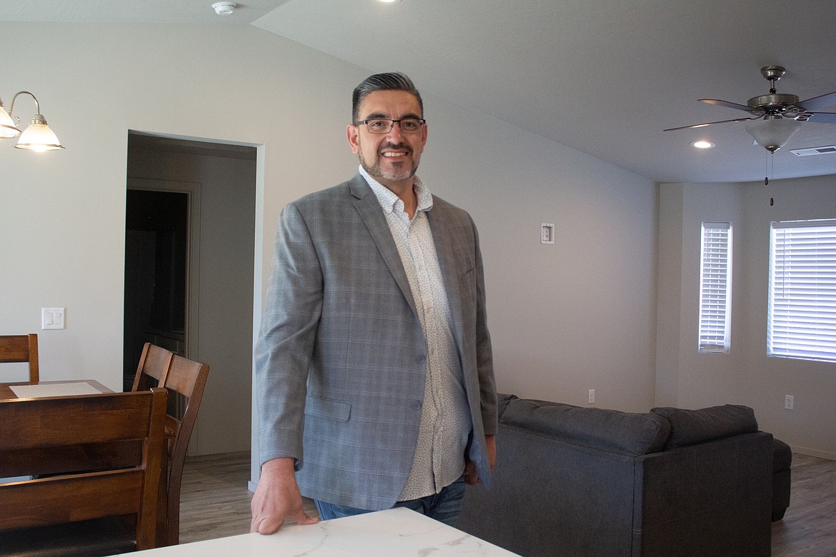 Othello realtor Jessie Dominguez stands inside one of the homes recently completed in Othello that still holds a lot of the modern, open-floor ideals buyers are looking for while giving up a few of those amenities to keep costs affordable for first-time homeowners.