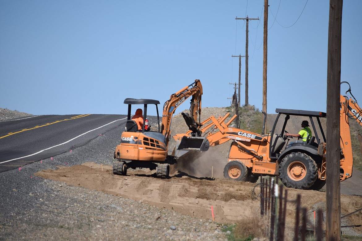 Construction workers at the Port of Moses Lake's new West Side Industrial Park move dirt for Renton-based Stoke Space Technologies, which has announced it is building a rocket engine testing center on 2.3 acres leased from the port.