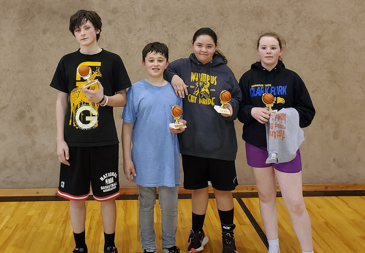 From left: Everett Montgomery, Jason Mayorga, Priscilla Mayorga and Aurora Lane claimed the junior high title at the first Filling Station Youth Center 3-on-3 basketball tournament on March 27.