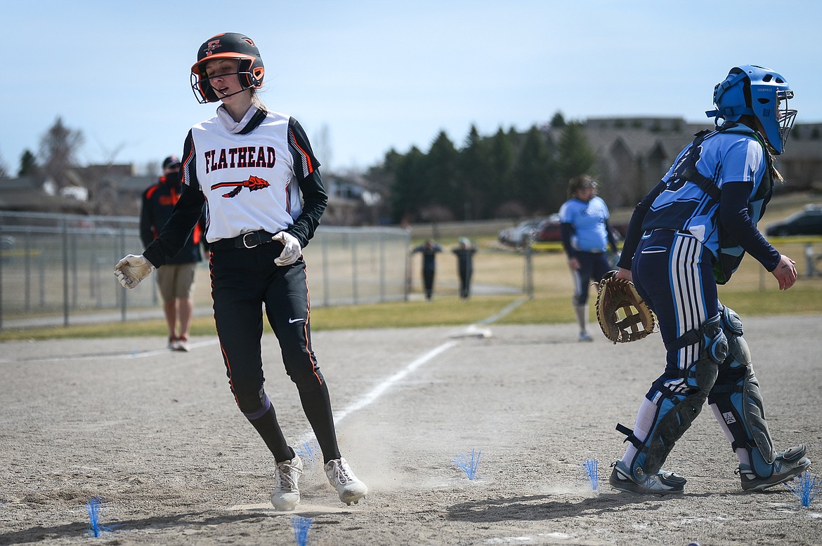 Flathead's Macy Craver (30) scores a run in the first inning against Great Falls at Kidsports Complex on Friday. (Casey Kreider/Daily Inter Lake)