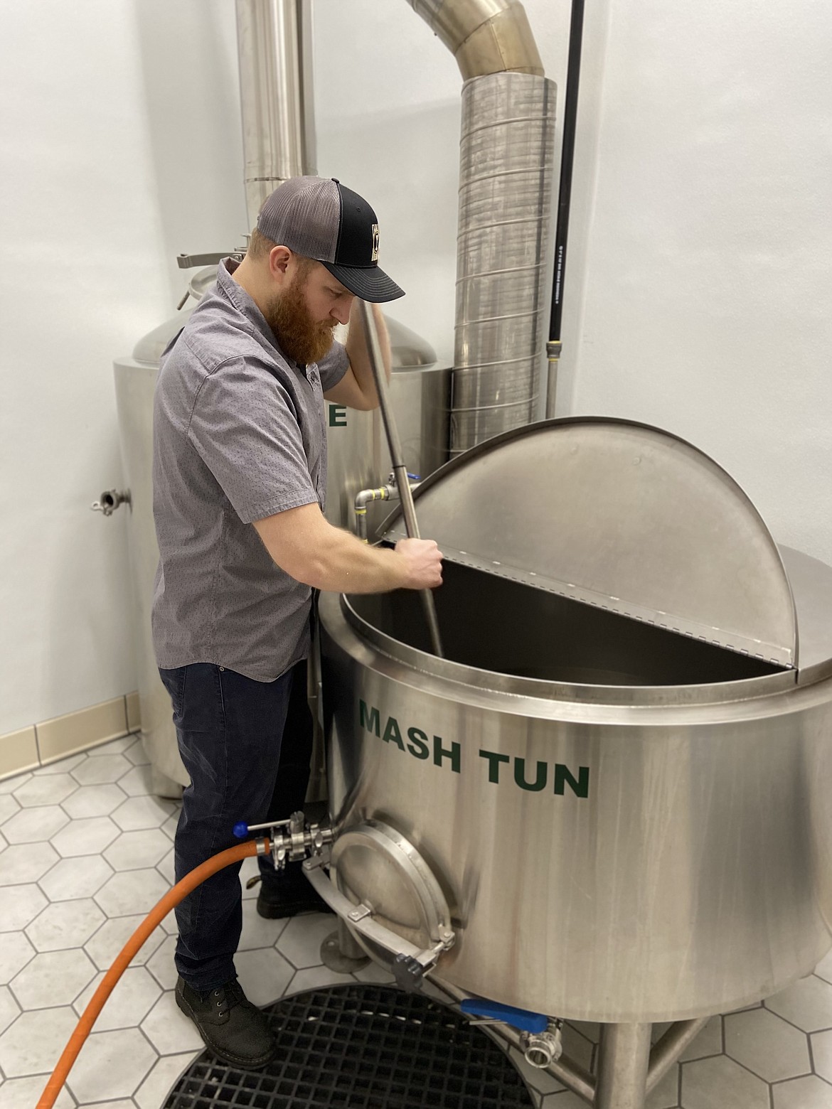Courtesy photo
Brian Engdahl, owner and head brewer at Chalice Brewing, tests the brewing equipment at the downtown Coeur d'Alene business. It opens Friday at 413 E. Sherman Ave. (beside the Art Spirit Gallery).