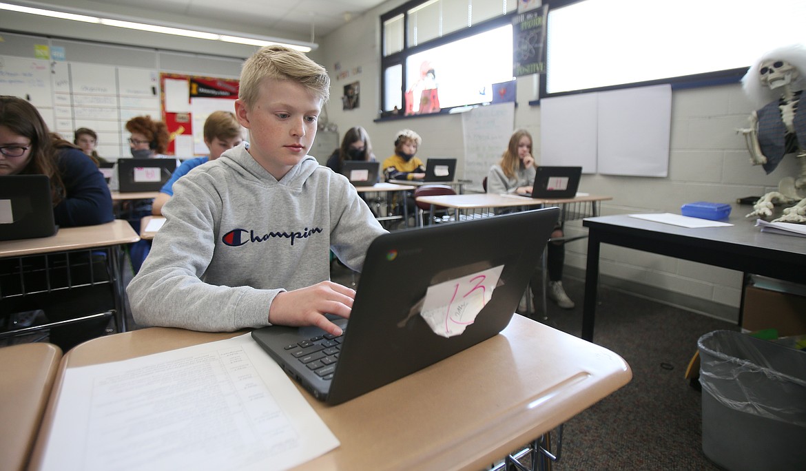 Landon Nagle researches African lions in class Wednesday at River City Middle School. A levy for the Post Falls School District is coming up May 18. Technology for students is supported by levy funds.