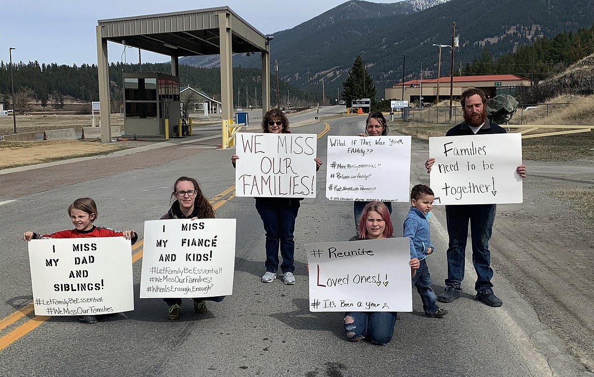 Members of families separated by the border between the U.S. and Canada due to COVID-19 restrictions gather to protest at the Port of Roosville in Montana on Saturday, April 3, 2021. (Brandy Carvey)