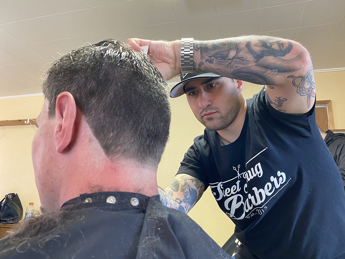 Paul Nemec, founder of the Idaho chapter of "Street Thug Barbers," was excited to get back to the St. Vincent de Paul HELP Center after COVID-19 restrictions put their volunteer work on hold. (MADISON HARDY/Press)