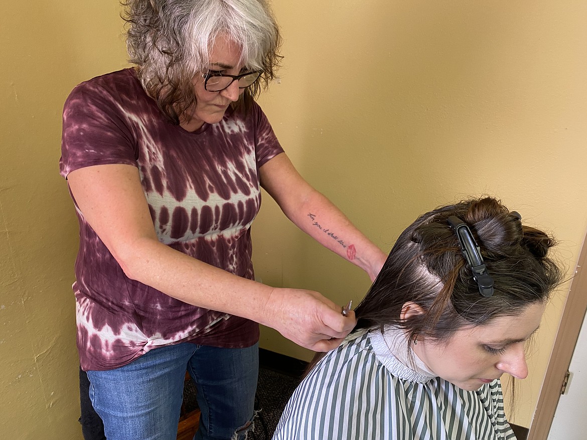 It was Lisa Tierney's first time participating with the Idaho chapter of "Street Thug Barbers," but she was happy to give back to the community. (MADISON HARDY/Press)