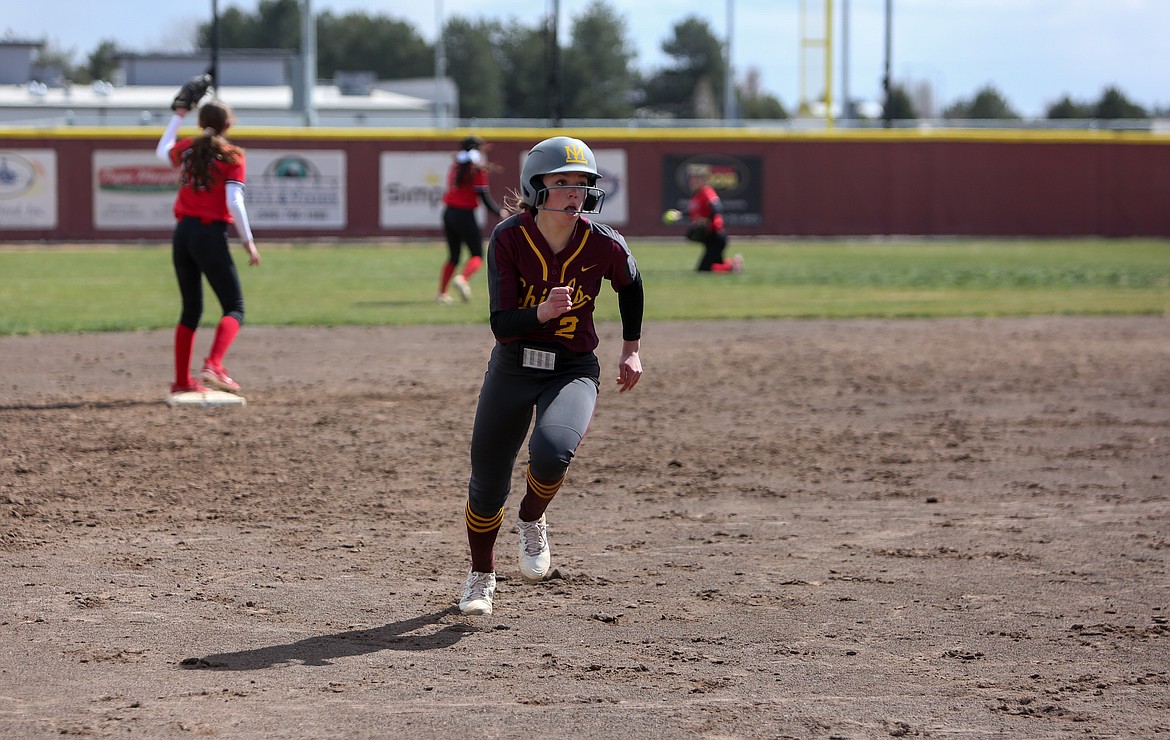 Moses Lake High School's Raegan Hofheins makes a dash towards third base in the opening matchup of the jamboree on Saturday afternoon against Othello High School.