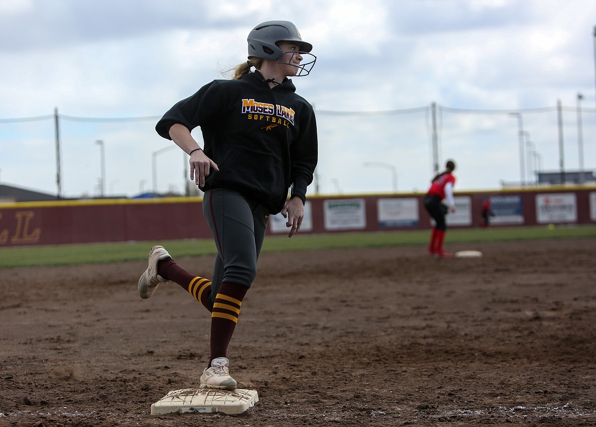 Moses Lake's Sydney Ries rounds third base as she makes her toward home plate at the softball jamboree at Moses Lake High School on Saturday.