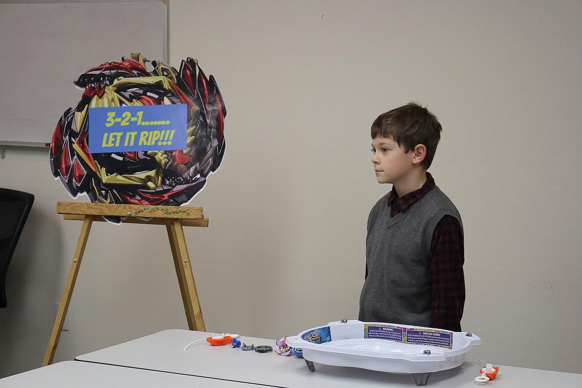 Eight-year-old Noah Scharfe gives his demonstration on how to conduct a beyblade battle Sunday in Thompson Falls at the finals of the annual Sanders County 4-H Communication Days event. (Monte Turner/Valley Press)