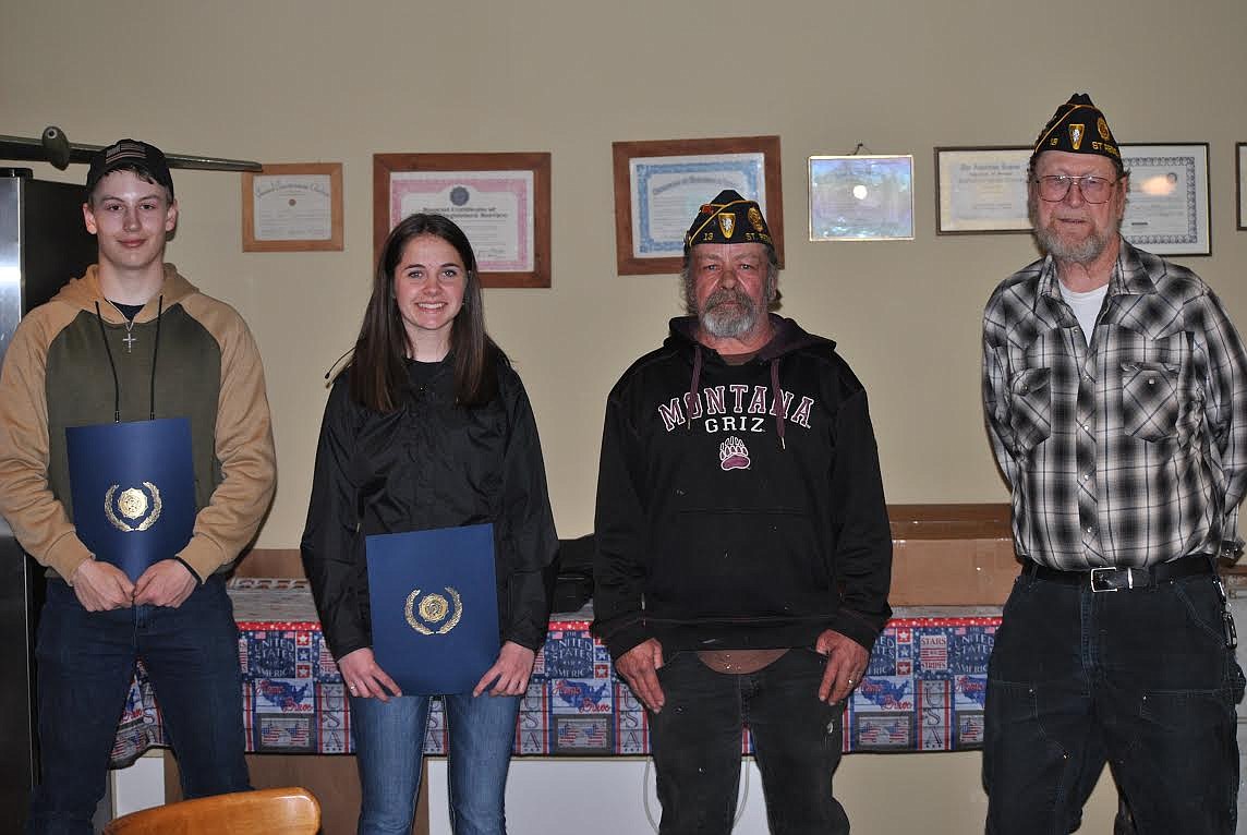 Heath Edison and Bailey Milender represented half of the Montana 10X Shooting Sports Team as they accepted an award last week from American Legion Post in St. Regis. Legion members Vince Triplett and Scott Burrows presented the certificates. (Amy Quinlivan/Mineral Independent)