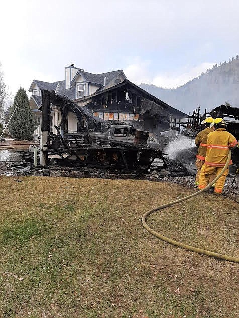 Volunteer firefighters from Superior and St. Regis tackled a blaze Saturday afternoon at a  Stageline Drive residence in Superior. The very aggressive structure fire began in the garage of the two-story home. After two hours and six loads of tender supplied water crews were able to stop the spread of fire. The home experienced significant damage due to high winds during the fire and multiple explosions from welding gas bottles. The owner had constructed the home long ago with good fire separation walls which helped slow fire extension. Numerous vehicles and collector cars were lost in the fire, but Steve Temple, Superior Volunteer Fire Department Chief, noted all residents were accounted for with the exception of one cat. "Thanks to St . Regis once again for their assistance!” Temple said. (Photo courtesy Kat Kittridge, St. Regis VFD assistant chief)