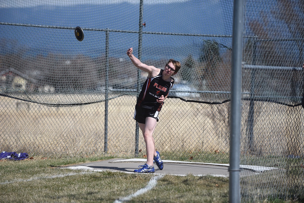 Plains’ Levi Blood throws the discus during the Dave Tripp Memorial track and field meet at Polson High School Friday. (Scott Shindledecker/Valley Press)