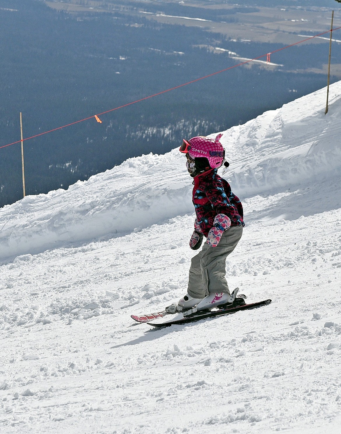 A young skier enjoys the sunshine in April at Whitefish Mountain Resort. (Whitney England/Whitefish Pilot)